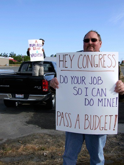 Department of Defense employee Ron Witherall protests during the July furloughs. As a result of the most recent furlough last week