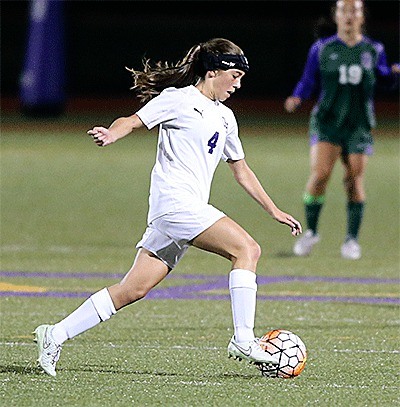 Jenna Cooley races up the field for the Wildcats Thursday. The sophomore scored Oak Harbor's goal in the 2-1 loss.