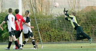 Coupeville’s Evan Ameluxen-Coleman makes a leaping save in the second half.