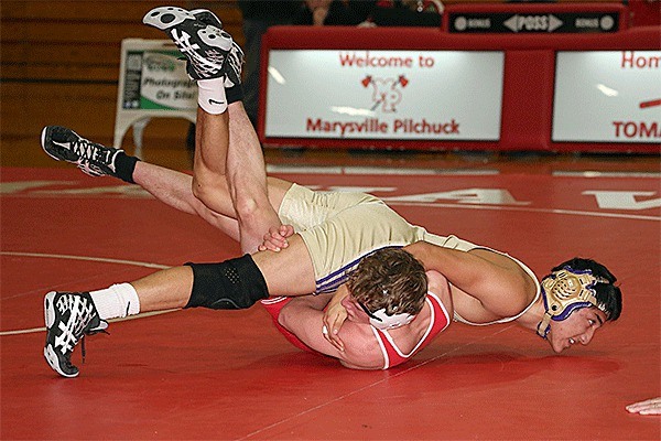 Michael Lym nearly pins Marysville-Pilchuck's Greg Steele on the way to a 15-0 win.