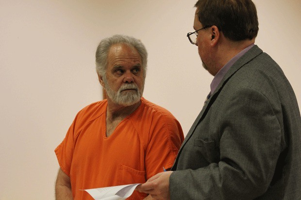 Accused murderer Robert Baker speaks with attorney Tom Pacher at a Sept. 20 hearing.