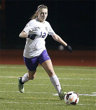 Alyssa Cross closes in on the ball in Oak Harbor's match with Shorewood on Thursday.