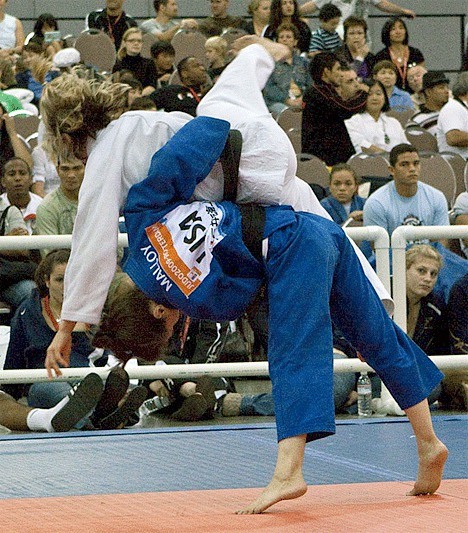 Marti Melloy (blue uniform) throws her opponent in winning the Belgian Ladies’ Open.