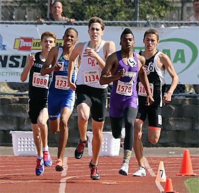 Oak Harbor's Dejon Devroe (1578) leads the 800 coming out of the final turn. The Wildcat senior won the event in a school-record time.