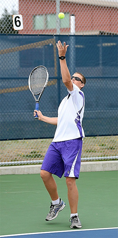 Jared Hunt serves during his win in first doubles on Thursday.