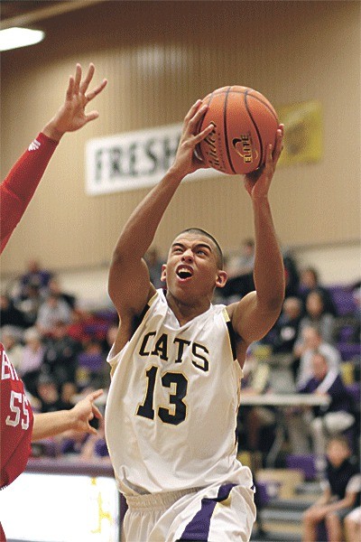 Mike Washington Jr. powers to the hoop against Mountlake Terrace for two points; the basket broke the school career scoring record.