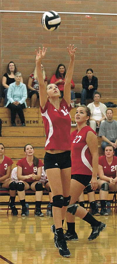 Allie Hanigan sets as Bessie Walstad looks on in Thursday's match with South Whidbey.