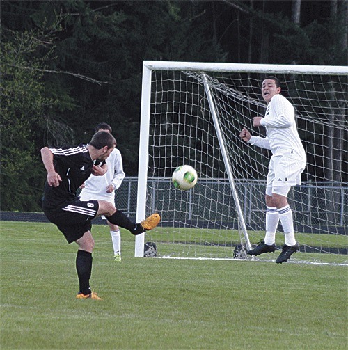 Coupeville's Luke Pelant fires a shot during Tuesday's match at South Whidbey.