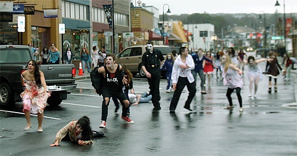 Zombies make mayhem on Pioneer Way Saturday for the filming of “Thrill the Island