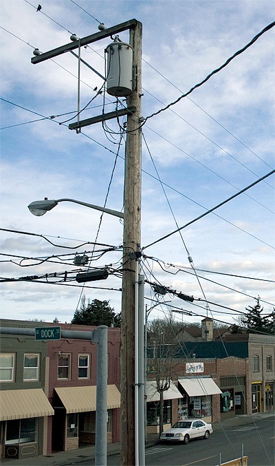 A power pole at the corner of Dock Street and Pioneer Way obstructs an eastbound view. The city of Oak Harbor plans to bury the utility lines during the downtown revitalization project beginning Jan. 2011. Officials hope to fund the project with $2 million in pending grants.