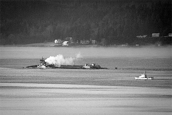 People with view homes on the Southwest end of Whidbey Island saw an unusual sight this morning: a submarine being escorted or pushed by tugboats. Photographer David Welton said this location is just north of the Kingston ferry dock