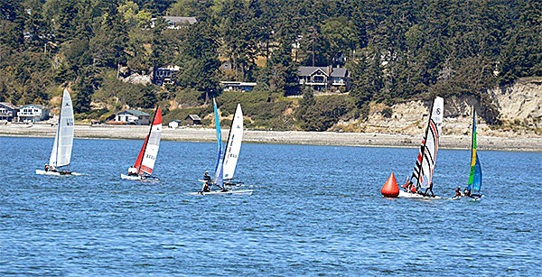 Sailors take part in the first Whidbey Island Race Week dinhy races Saturday.