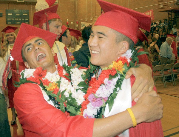 Amiel Ko carries Austin Nichols before Friday’s graduation ceremony at the Coupeville High School gymnasium. They are both heading to Washington State University in the fall. They were two of more than 70 graduating seniors. See A10 for coverage of Coupeville’s graduation ceremony.