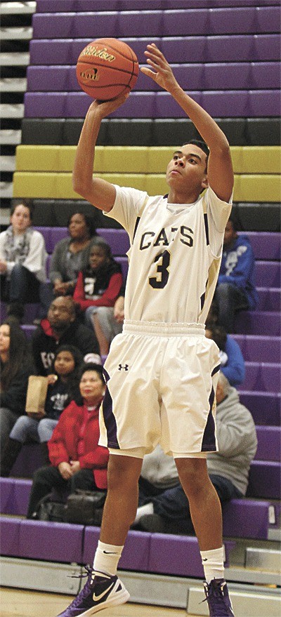 Bombs away! Drew Washington launches one of his eight successful three-point shots in Oak Harbor's win over Lynnwood.