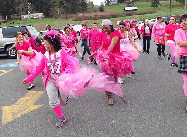 Choreographer Bernice Manglona leads a flash mob in a dance Saturday to support the recovery of cancer patient Christine Eborda.