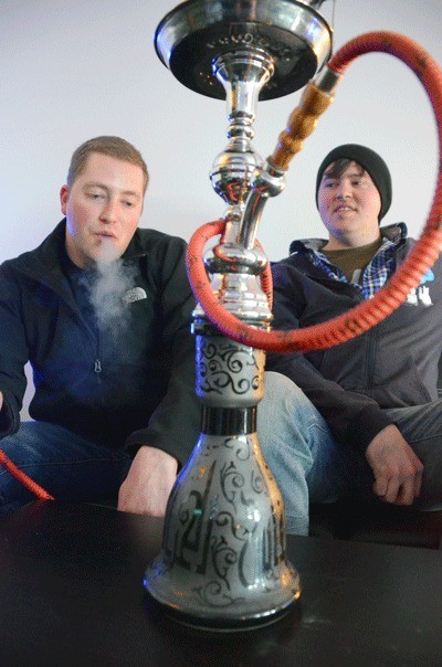 James Ryan and Charles Morgan are opening the Haze Hookah Lounge in downtown Oak Harbor this month. They learned to love the water pipe while serving overseas.