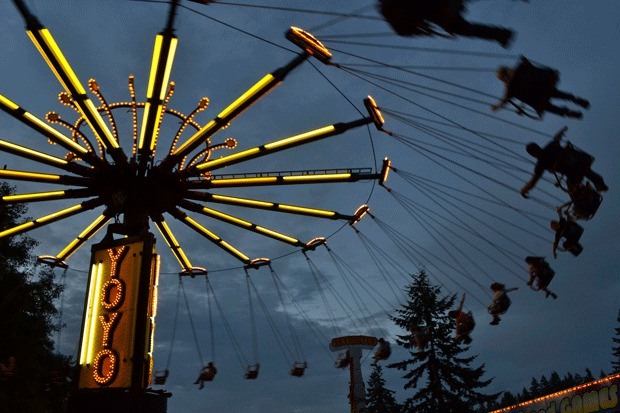 Carnival-goers enjoy one of the rides during last year’s Whidbey Island Area Fair. A multimillion dollar plan to revamp the fairgrounds has drawn criticism from a group of island residents.