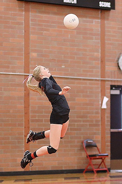 Ally Roberts fires a jump serve in Thursday's win over Port Townsend.