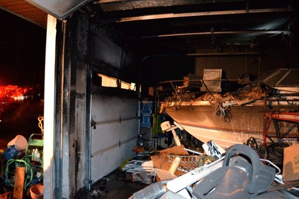 A garage and its contents remained blackened and scorched after a fire late Monday off Fort Nugent Road. The North Whidbey home was saved by the quick actions of the homeowner