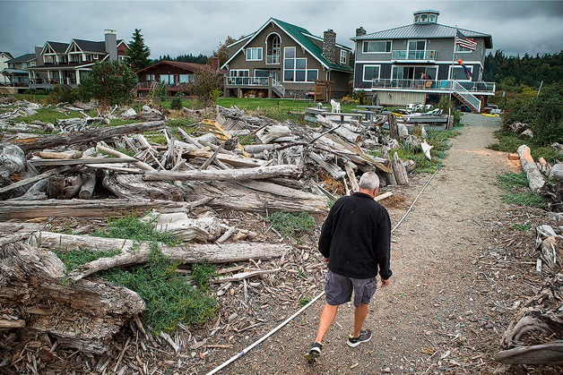 Cliff Marston walks to his house located on Camano Island’s Iverson Road on Sept. 7.