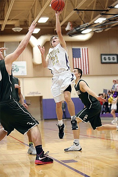 Adam Nelson floats to the hoop for two points in Oak Harbor's loss to Shorecrest Friday.