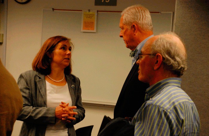 Island County Commissioner Helen Price Johnson speaks with Port of Coupeville Commissioner Marshall Bronson following a recent work session addressing the allotment of conservation futures funds.