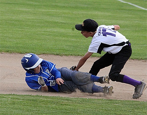 North Whidbey first baseman Chris Shashaty tags out a South Whidbey runner during a rundown Friday.