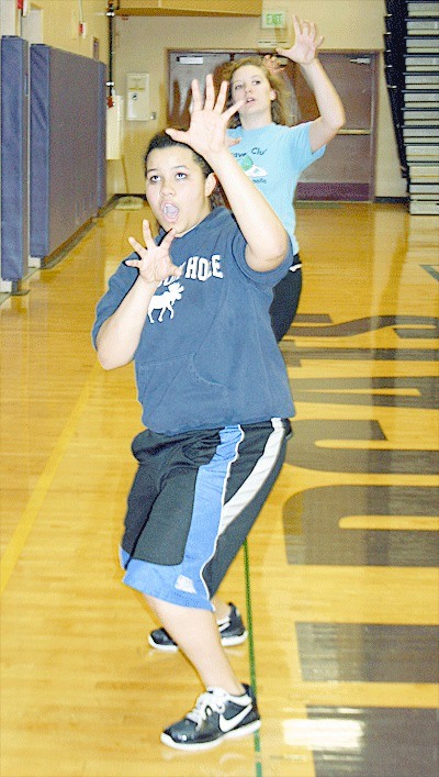 Oak Harbor High School Choir Club president Shani King teaches a group the dance moves to 'Thriller.'