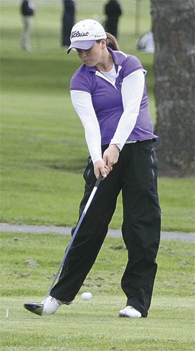 Annie Leete drives her opening tee shot at the league meet Tuesday. Leete went on to win the individual league point title.