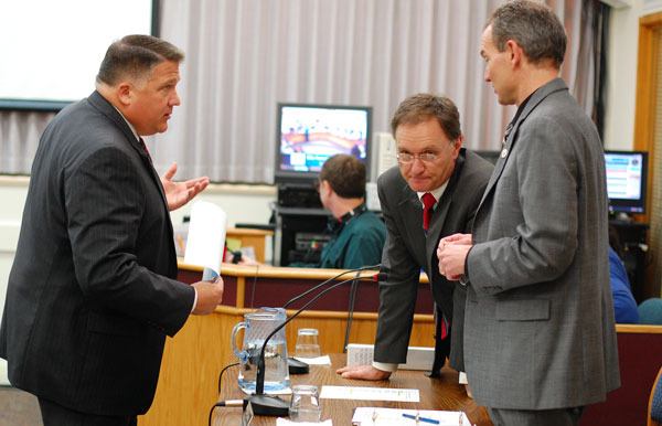 Oak Harbor Mayor Scott Dudley speaks with new City Attorney Bill Hawkins and interim City Administrator Steve Powers before a special meeting Monday. Hawkins confirmed Wednesday that the selection of four finalists in a closed session during the meeting violated the state's Open Public Meetings Act. The entire process is now expected to be redone.