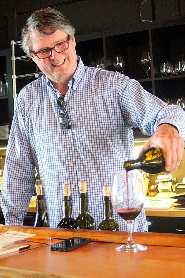 Ott & Murphy tasting room manager Bob Thurmond pours the winery’s double gold–winning 2010 syrah.