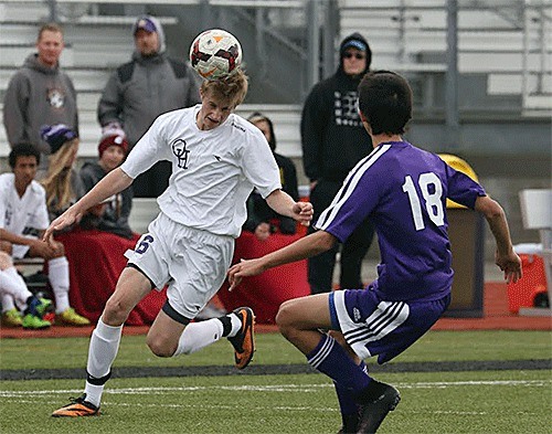 Kurtis Zylstra heads the ball for the Wildcats.