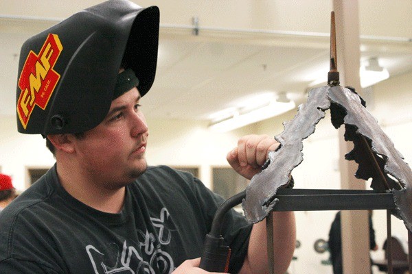 Oak Harbor High School senior Greg Ennis works in his metal shop class. Ennis