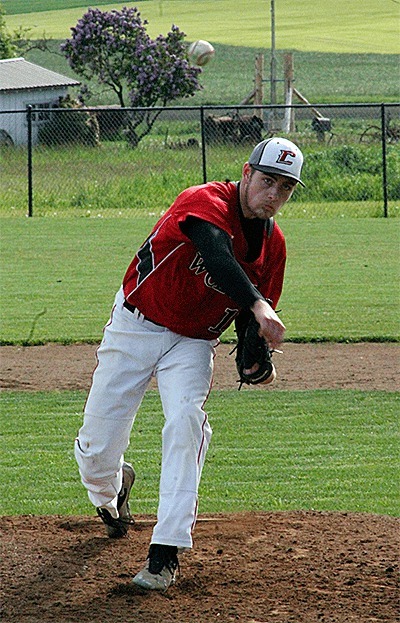 Aaron Curtin flings a pitch in the Wolves' win Tuesday. Curtin struck out nine in the 8-1 win.