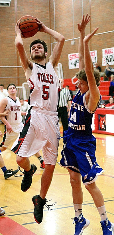 Jordon Ford muscles by Bellevue Christian's Eric Kats.