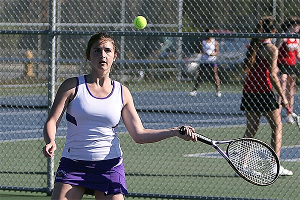 Emma Lerch returns a shot for Oak Harbor. She teamed with Peyton Carlson to win first doubles.