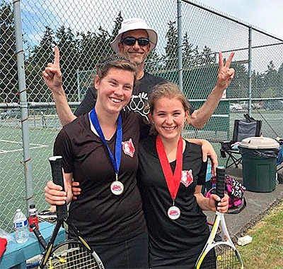 Coupeville tennis coach Ken Stange indicates that Jacki Ginnings