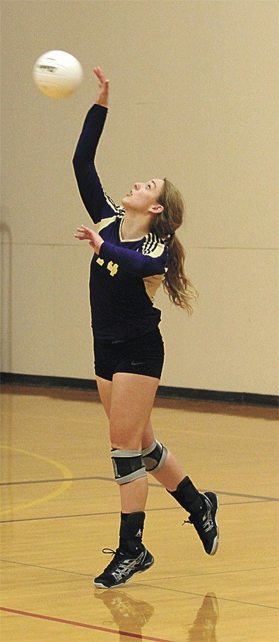 Hannah Christensen serves in Oak Harbor's one-sided win Tuesday.