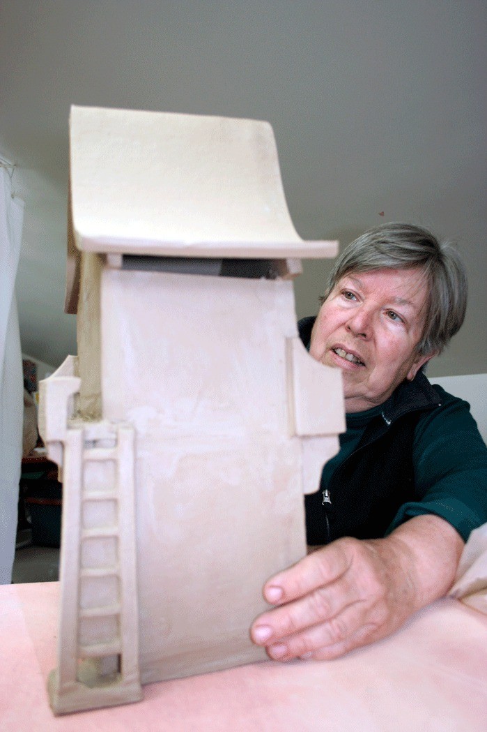 Maryon Attwood works on a spirit house for the upcoming Visual Voices art show June 23 and 24 to benefit the Whidbey General Hospital Foundation.