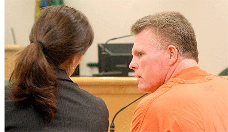 Convicted rapist Bryan Ross consults with an attorney during his sentencing hearing.