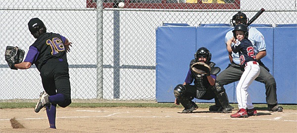 North Whidbey pitcher Kenneth Morrow fires to catcher Chris Trisler as he strikes out South Skagit's Finn Wilson.