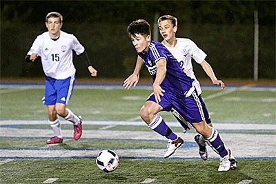 Oak Harbor's JJ Mitchell races up the field in Tuesday's match with Shorewood.