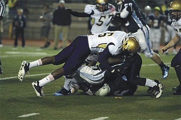 Casey Ferguson levels a Meadowdale ball carrier.