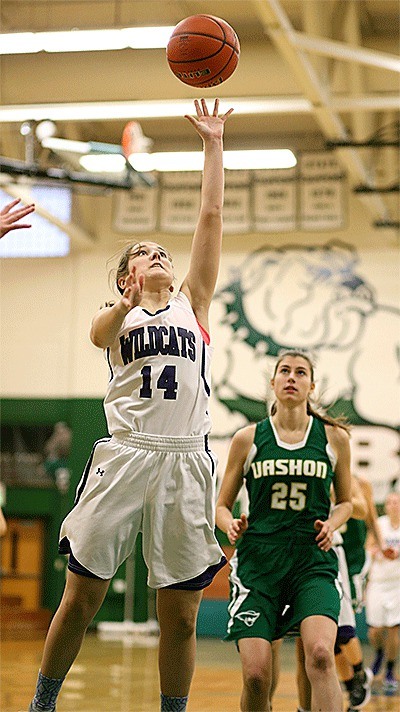 Bryn Langrock scores two of her 12 points to lead Oak Harbor over Vashon Island Monday.