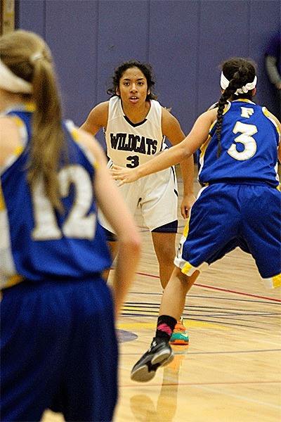 Oak Harbor's Rashanna Graham looks for an opening in the Ferndale defense.