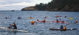 Competitors battled Bowman Bay’s choppy waters and a stiff wind Sunday morning