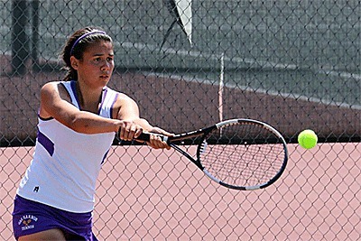 AnnaBelle Whitefoot shots a backhand at the district tournament Wednesday.