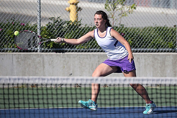 Oak Harbor's Emma Wezeman runs down a shot in her win with partner Emily Brown in third doubles.