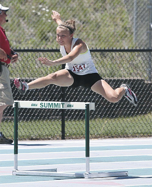 Kaitlyn Chelberg races to second in the 200 hurdles to qualify for the national USATF Junior Olympic finals.