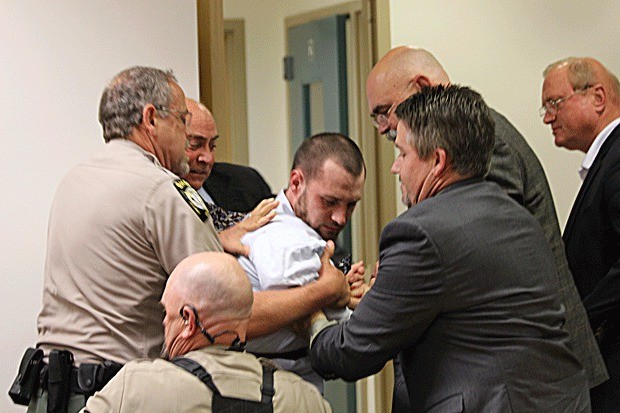 Accused murderer Joshua Lambert became violent during his trial Tuesday and was subdued by law enforcement officers.